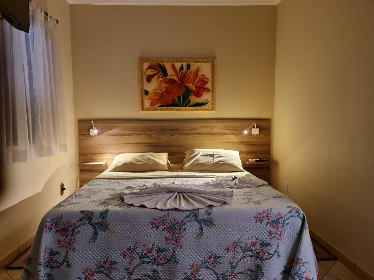 Pousada Nossa Senhora Penedo  Buitenkant foto A bedroom in a hotel in Brazil